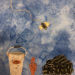 This quilt block shows a large brown and yellow fly with a trail of gray stitching on a blue background. Below it is a gray bucked with an orange label on it, and next to that a rust colored trowel. The largest item is a pile of black fabric with green marks on it representing manure. It has a white stitching outline around it.