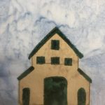 This quilt block shows a multi-level barn against a light blue salmon-patterned background. This barn is shaped like a barn with a wide triangular roof, but the center protrudes further up with a large two-story loft. The two sides are lower. The barn itself is a tan fabric with dark green windows, roofs, and doors. The dark green patches of fabric are outlined by a light green stitching. There is a small door on the left side, a huge door in the middle, and a small door on the right side. The loft has three lower square windows and one higher square window in a triangle formation.